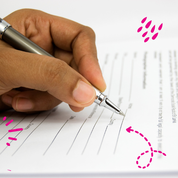 A hand with a pen, filling a form