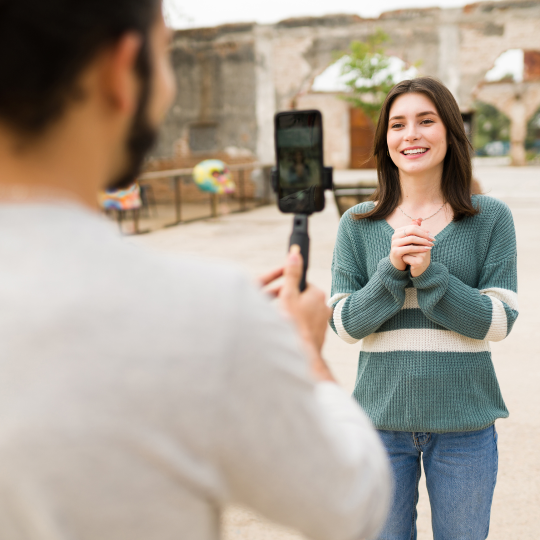 Woman filming a video on her phone